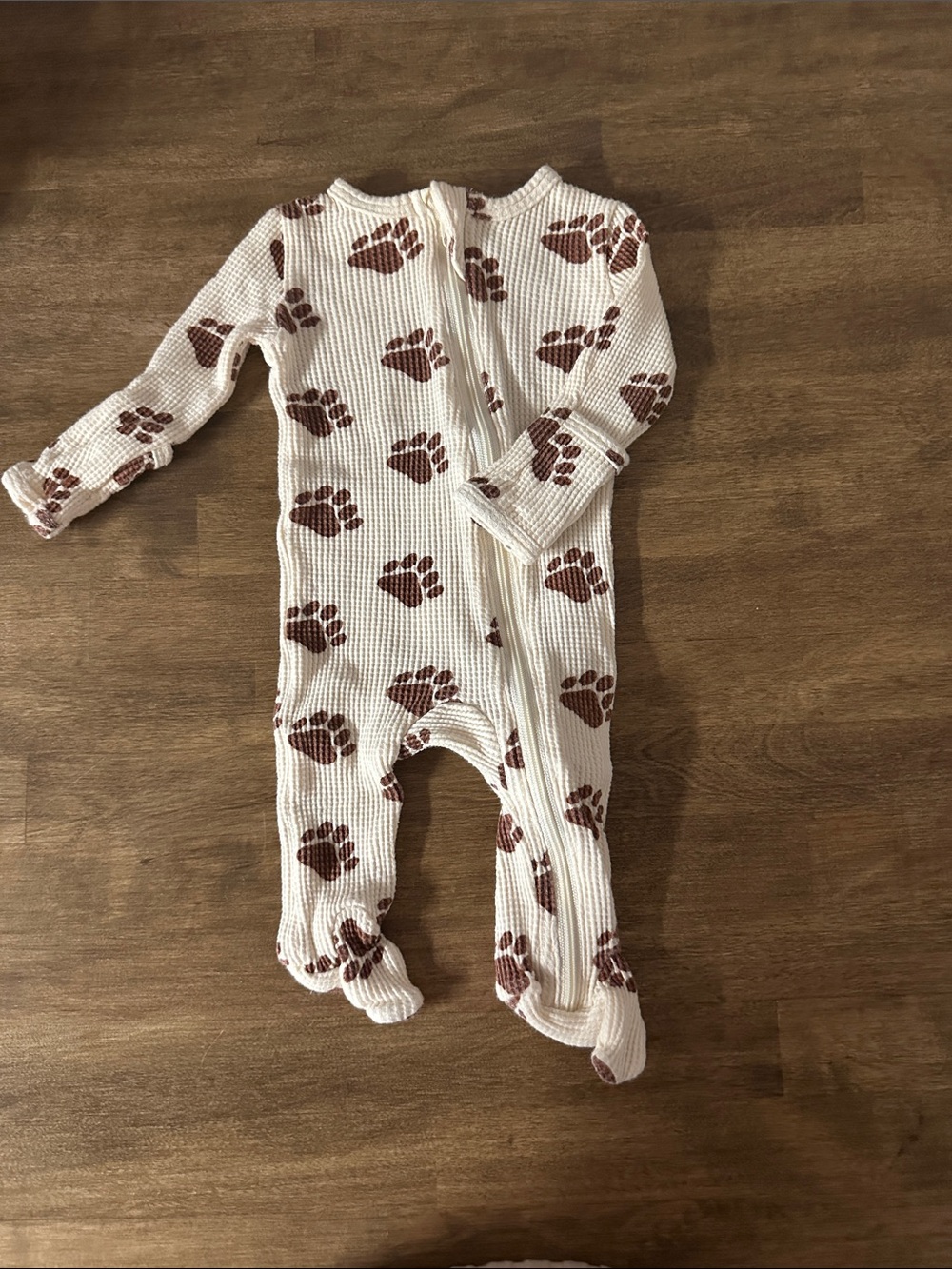 Cream Footed One-Piece with Brown Paw Print Pattern